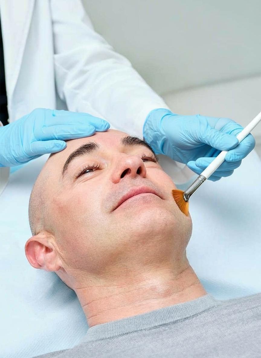 Man receiving chemical peelk in clinic
